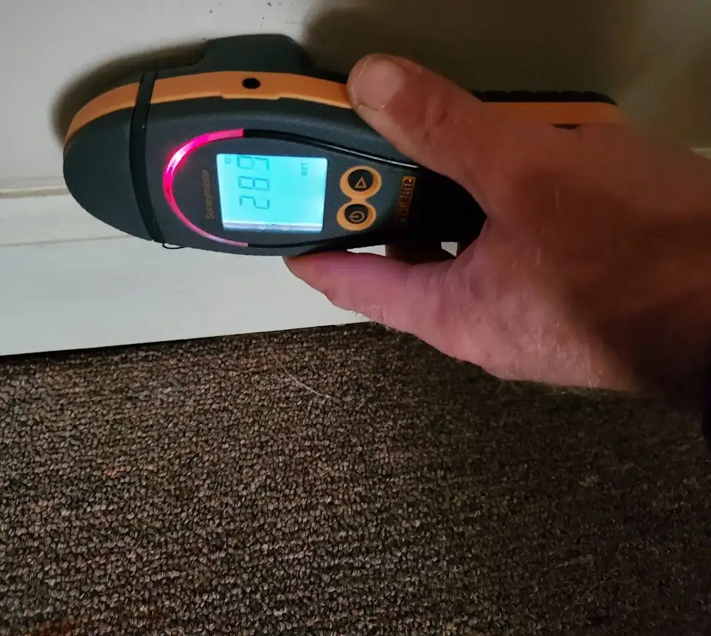 Moisture detection at baseboard during Storm Damage Restoration in Pacifica